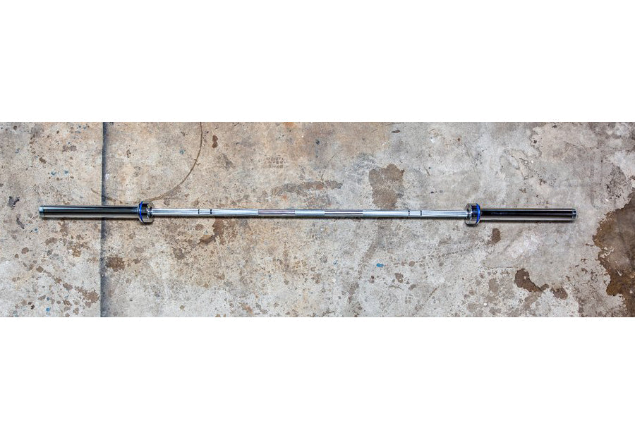 York Men's Elite Competition Olympic Bar with blue collars on concrete background, flat lay