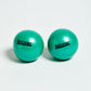 Pair of turquoise Aeromat mini weight balls with black branding, on white background