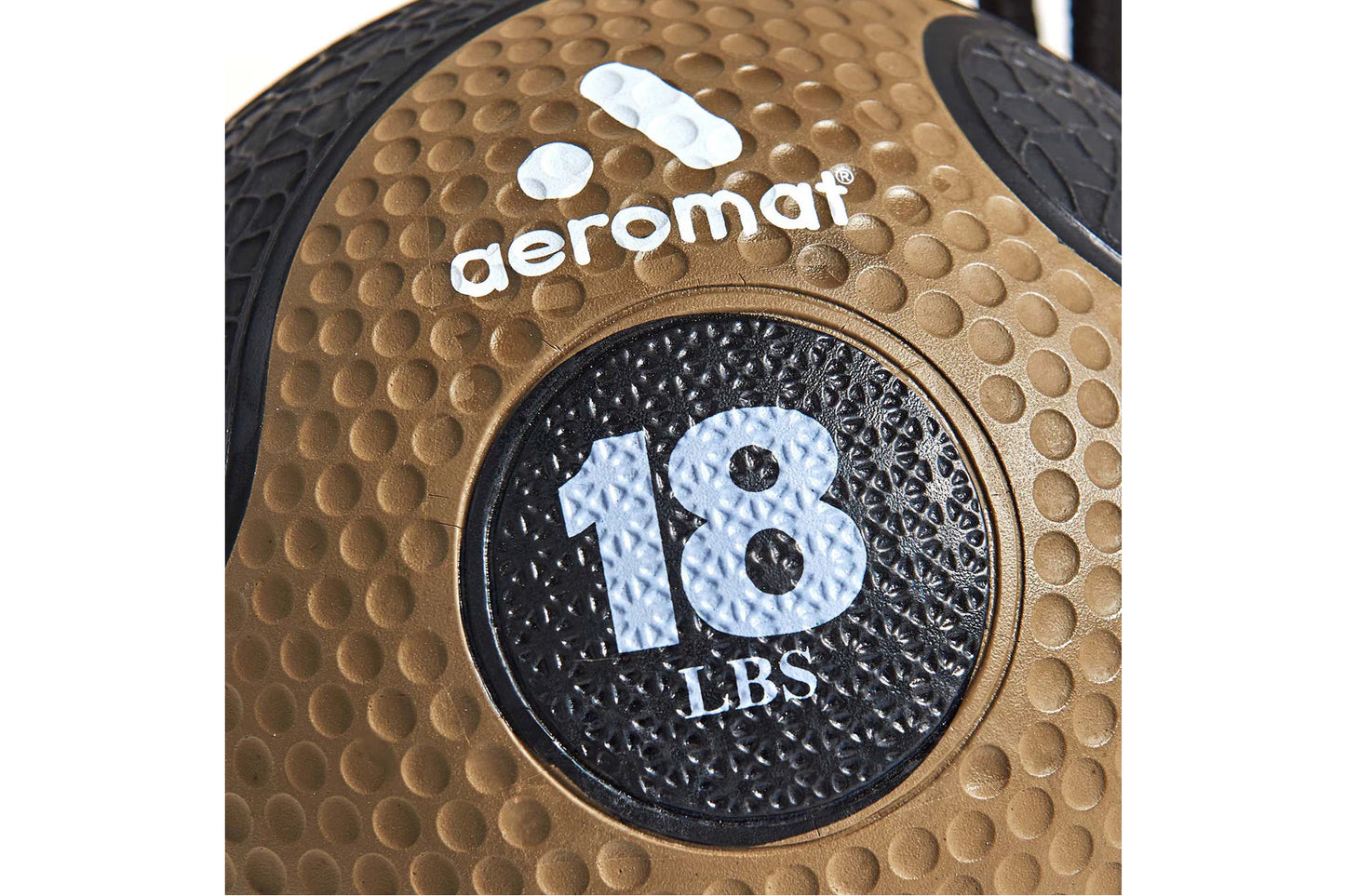 Aeromat 18 LBS medicine ball with textured tan and black rubber construction, weight marking visible on circular center panel