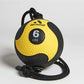 Yellow and black textured medicine ball with 6 LBS weight indicator, black braided rope handles, displayed on white backgroun