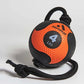 Orange and black rubber medicine ball with textured surface, black braided rope handle and cord attachment on white backgroun
