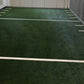 Warrior Agility Turf synthetic grass field with white yard line markings and metal fencing