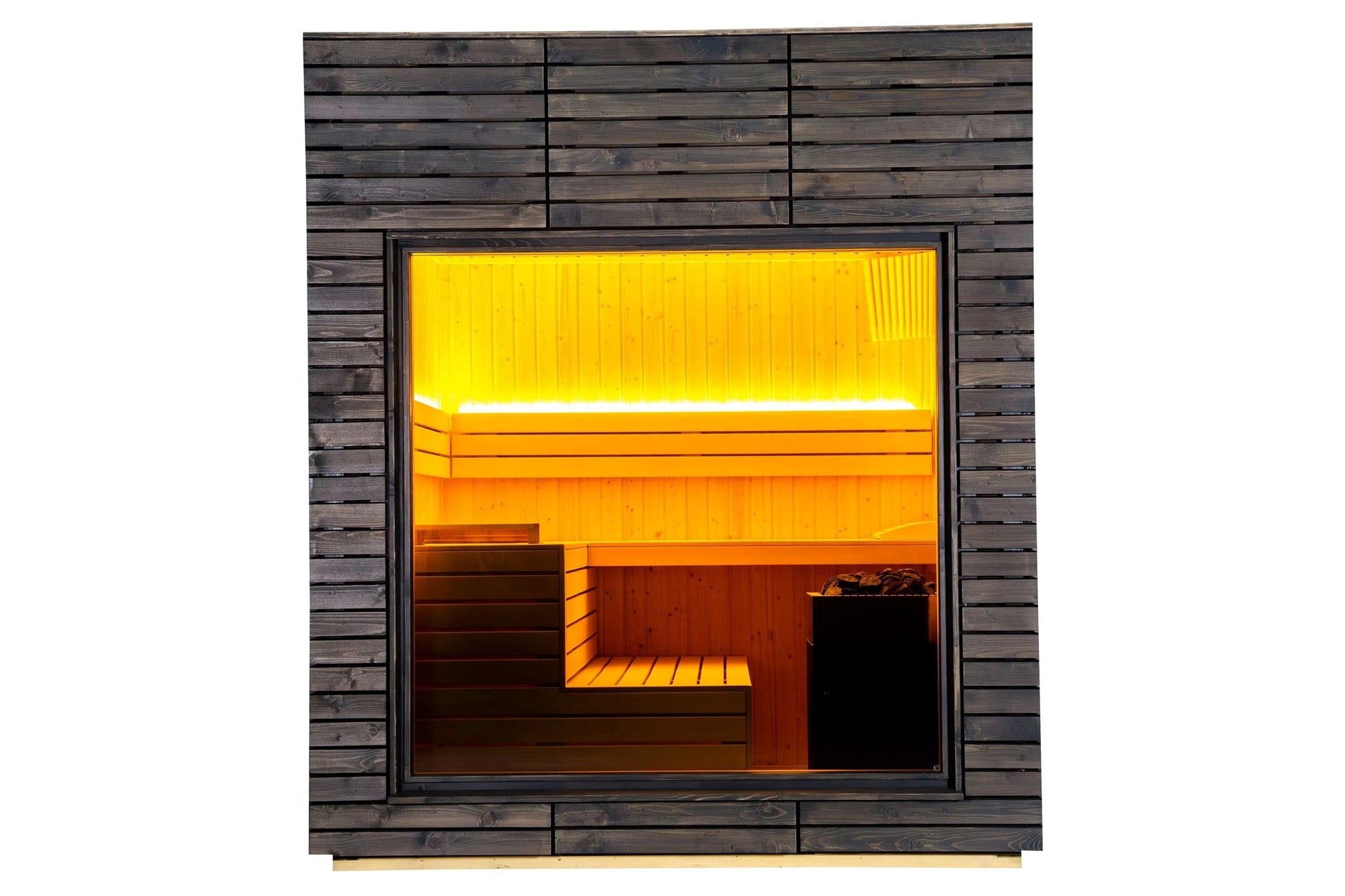 Almost Heaven Alpina outdoor sauna with dark wood exterior, glass door window, and glowing yellow-orange interior lighting sh