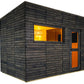 Modern black wood sauna cabin with large window showing warm yellow interior lighting, orange door frame, and horizontal ship