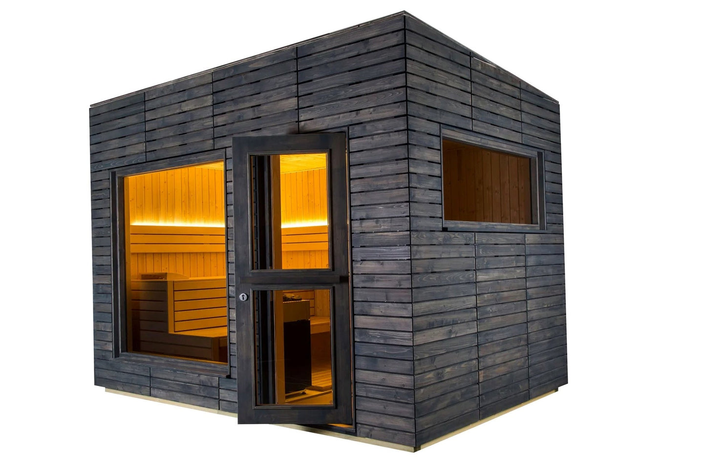 Almost Heaven Alpina outdoor sauna with dark stained wood exterior, illuminated golden interior visible through glass door an