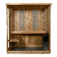 Cedar wood indoor sauna with two bench seats, vertical metal vents, and black heater box on white background