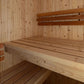 Natural wood sauna interior with light pine walls, wooden benches, and darker wood backrest, showing two-tier seating configu