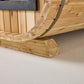 Natural wood sauna interior showing curved cedar walls and wooden bench seating detail on neutral background