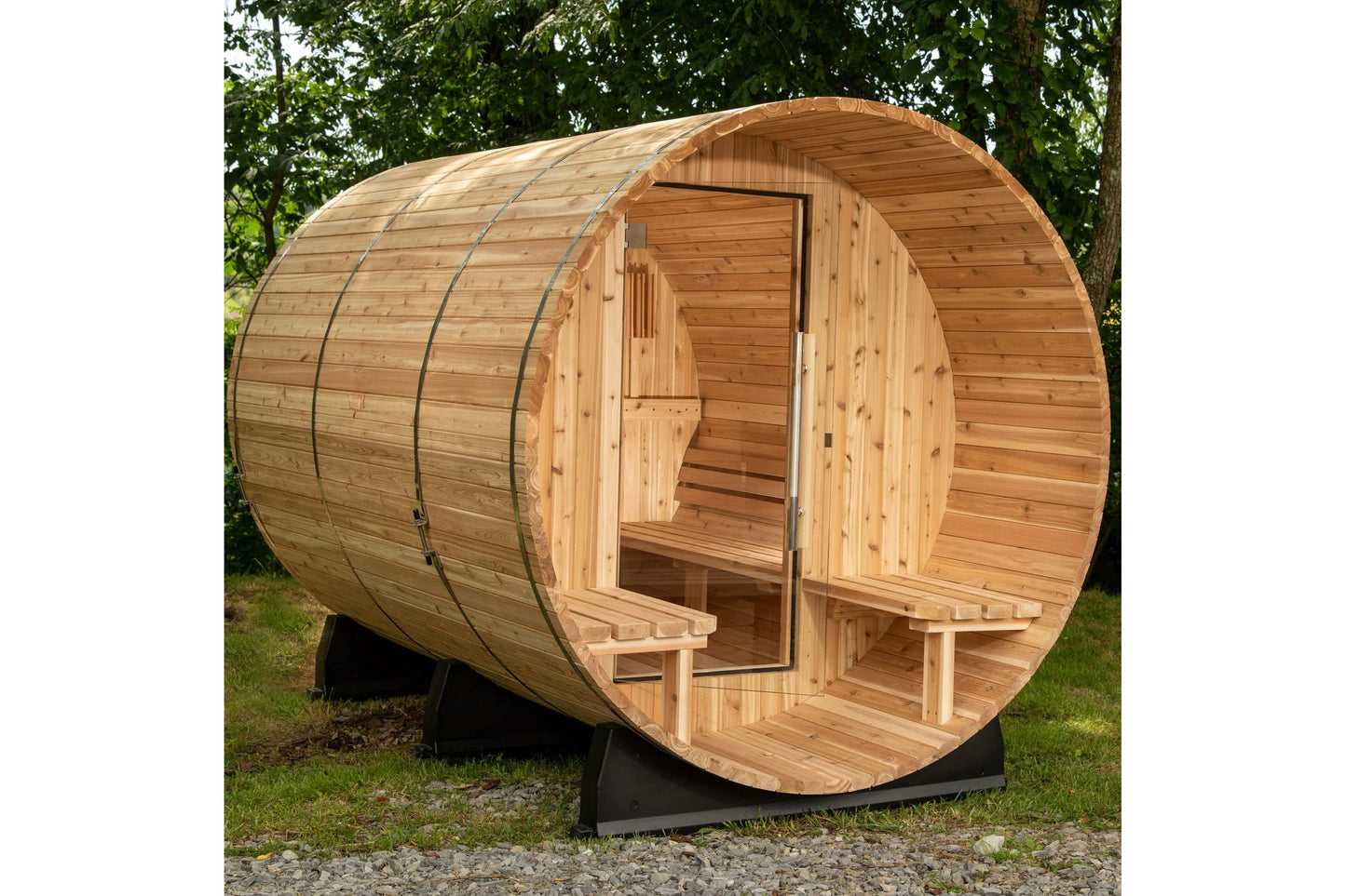 Wooden barrel sauna with curved cedar construction, open door showing interior bench seating, metal reinforcement bands, posi