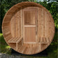 Cylindrical barrel sauna made of light cedar wood with arched roof, wooden door with window, and bench seating visible inside