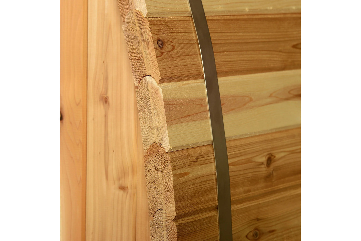 Natural wood barrel sauna corner detail showing rounded cedar logs and metal band, on white background