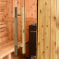 Glass sauna door with stainless steel pull handle and brass hardware on wooden barrel sauna interior