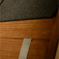 Charcoal gray wool exterior meets natural wood frame detail on barrel sauna construction