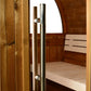Stainless steel pull handle with white accents on wooden barrel sauna door, interior view showing wooden bench and curved ced