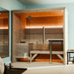 Almost Heaven Everwood indoor sauna with cedar wood construction, glass doors, horizontal slat benches, and orange ambient li