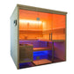 Almost Heaven Everwood sauna with light wood frame, glass doors, wooden benches, and chromotherapy lighting in orange and blu