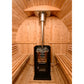 Interior view of wooden barrel sauna with black Harvia stove, metal chimney pipe, and arched wood ceiling with benches on bot