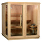 Natural pine wood indoor sauna with glass door and window, featuring cedar interior bench seating for four people, heater vis