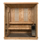 Natural wood indoor sauna with glass front door, two vertical heater panels, wooden benches, and black heater unit visible in
