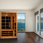 Almost Heaven Harmony 2-3 person infrared sauna with cedar wood construction and glass door, positioned in modern room with m
