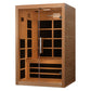Natural wood infrared sauna cabin with glass double doors, black interior panels, and interior bench seating, on white backgr