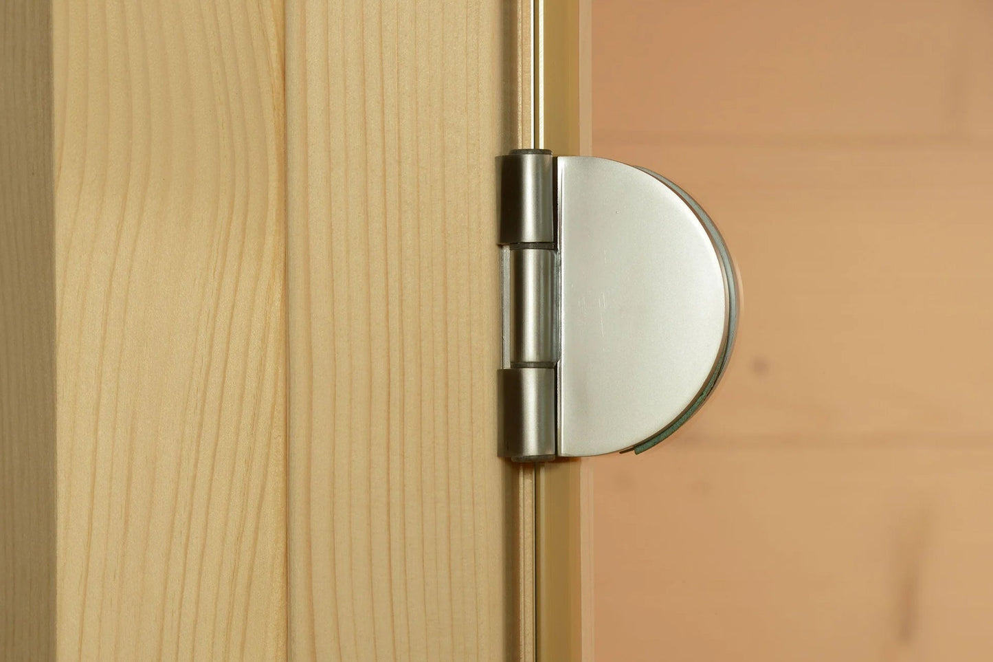 Stainless steel hinge with frosted glass panel on light wood door