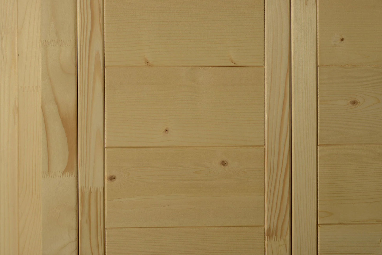 Light pine wood paneling with horizontal planks and natural knots, interior sauna wall detail