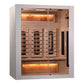 Almost Heaven Himalaya infrared sauna with glass doors, natural wood interior, and glowing amber heat lights on white backgro