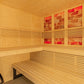 Almost Heaven Himalaya indoor sauna interior with light pine wood benches, horizontal slats, red salt brick windows, and meta