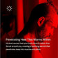 Man with beard in profile, bathed in red infrared heat lighting inside sauna