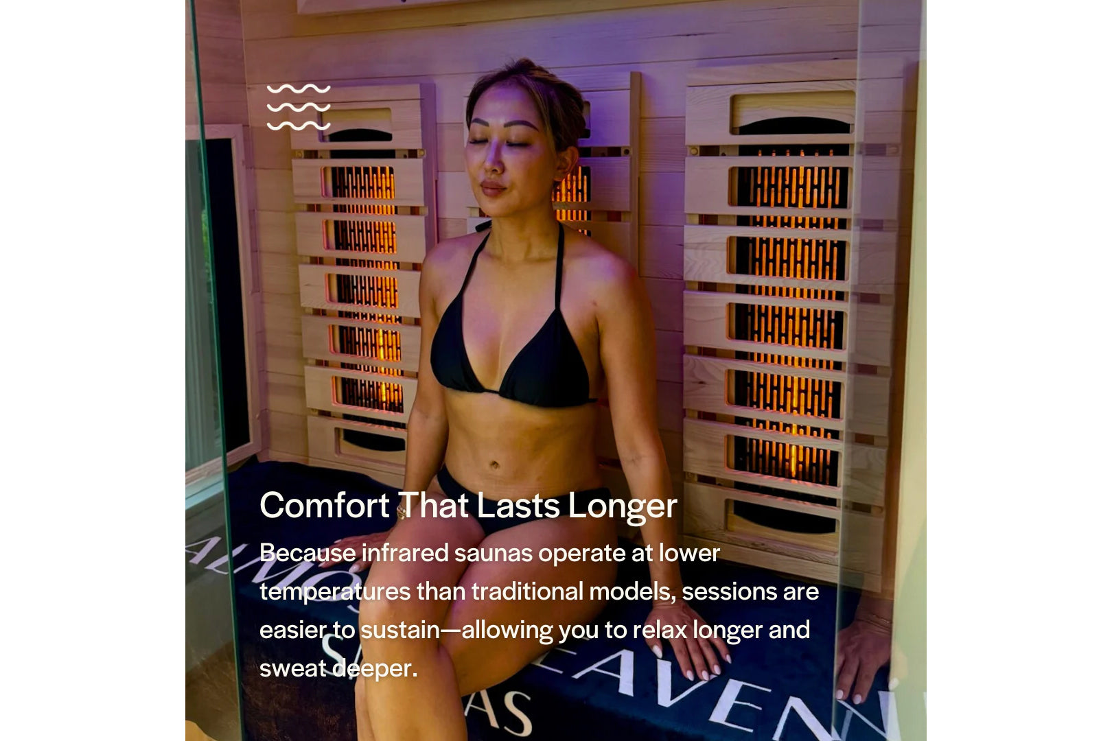 Woman wearing black bikini inside wooden infrared sauna with glowing heating panels and purple ambient lighting