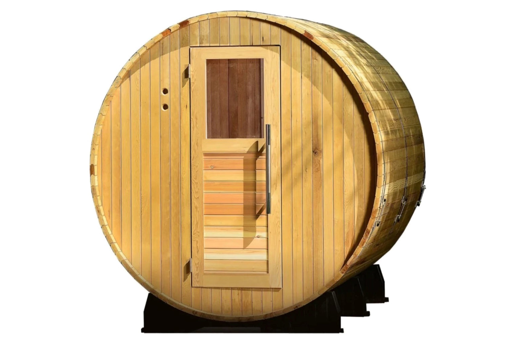 Barrel sauna with natural wood construction, rounded cylindrical shape, vertical wood planking, dark brown door with window, 