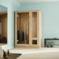 Almost Heaven Logan sauna with wood construction and glass doors in light blue spa room setting