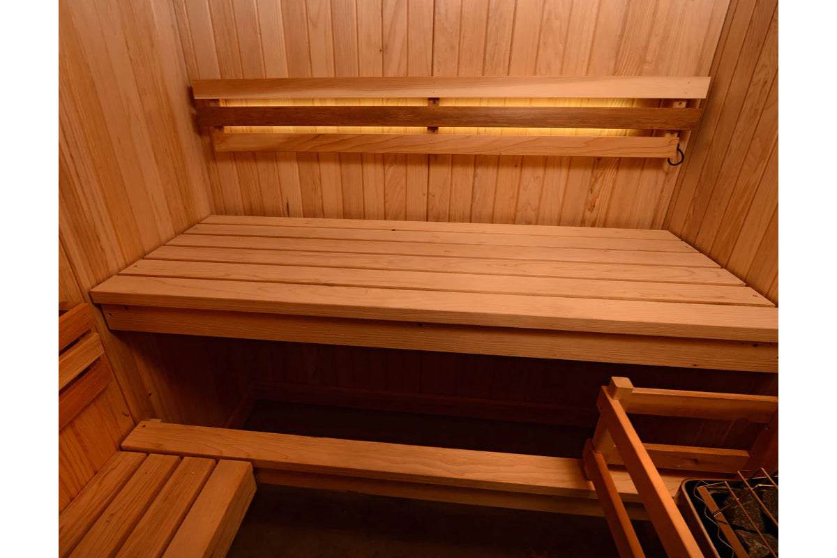 Cedar wood sauna interior with tiered seating benches and backrest mounted on wooden walls