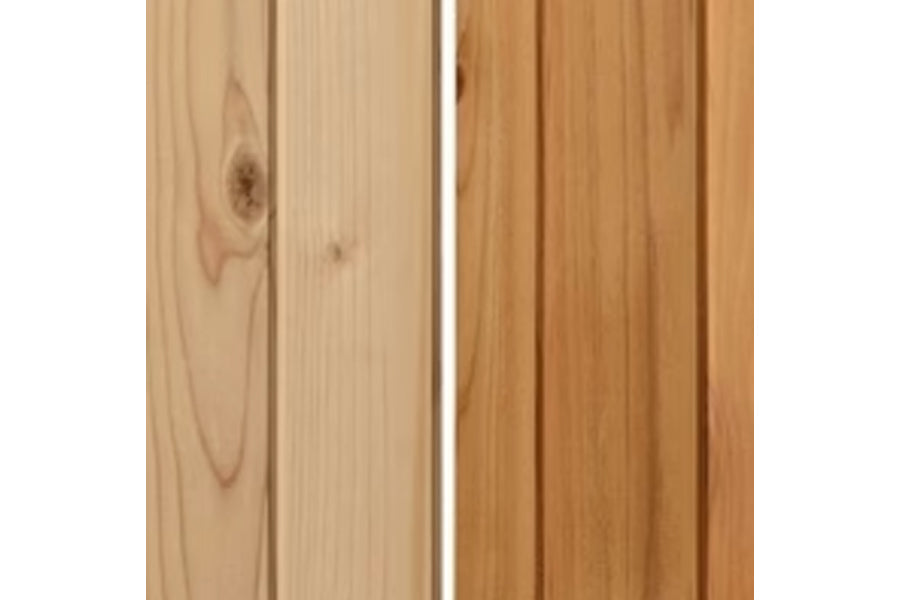 Light and medium cedar wood planks with natural grain patterns and knots, showing sauna interior construction detail