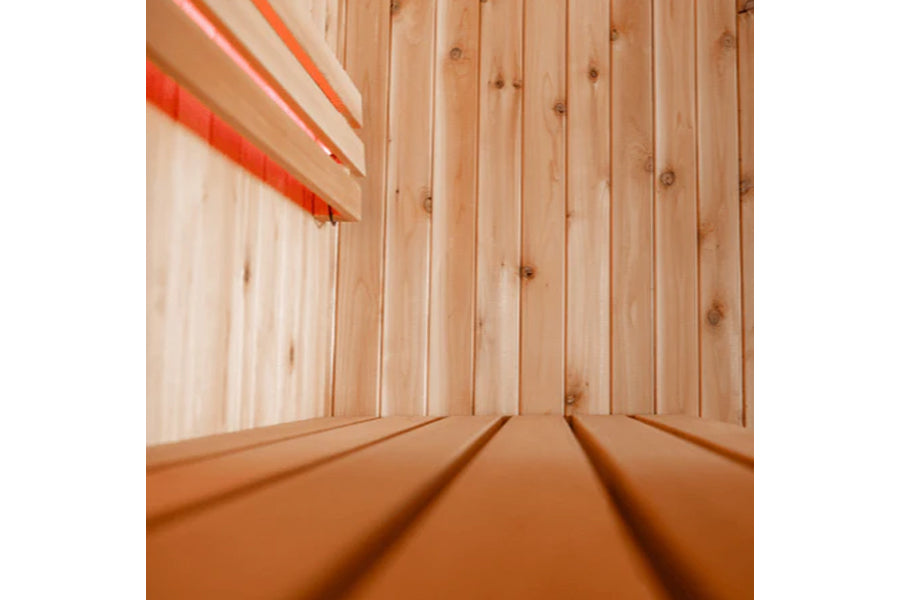Almost Heaven Madison hybrid sauna interior view with natural wood walls and orange heating elements visible at top