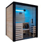 Black framed indoor sauna with glass doors, light wood interior, built-in bench seating, blue LED lighting, and control panel