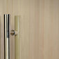 Stainless steel pull handle and light wood frame detail on sauna door against neutral wood background