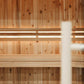 Cedar wood sauna interior with wooden bench seating and built-in lighting strips mounted on walls