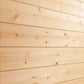 Light wood shiplap interior with horizontal planks and natural knots, showing corner sauna wall construction
