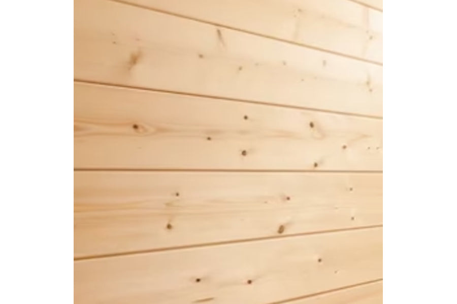 Light wood shiplap interior with horizontal planks and natural knots, showing corner sauna wall construction