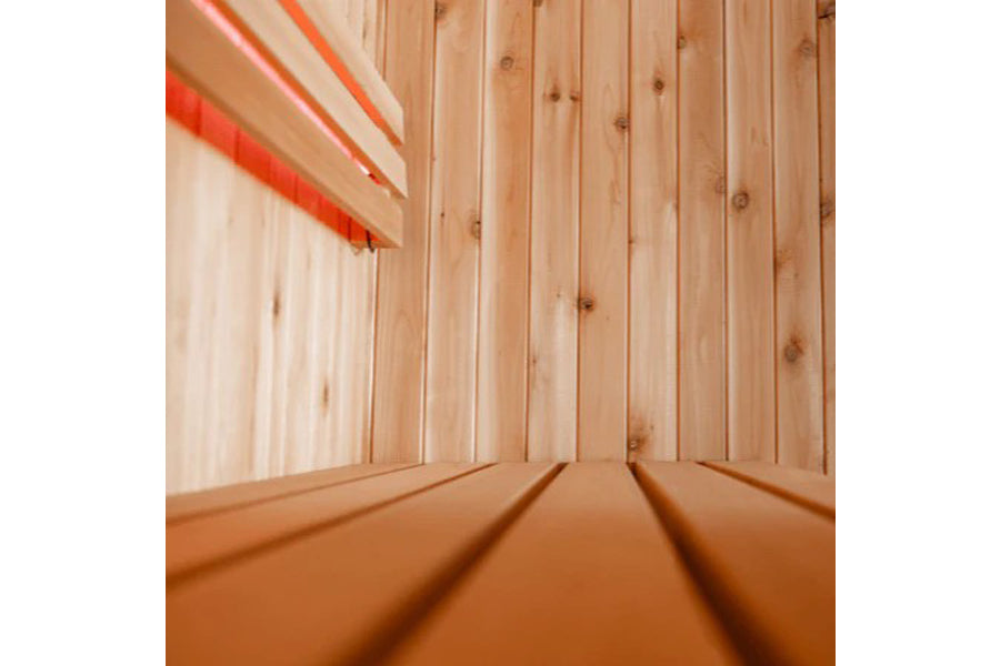 Almost Heaven Rainelle indoor sauna interior with light wood paneling, bench seating, and red accent lighting on wooden backg