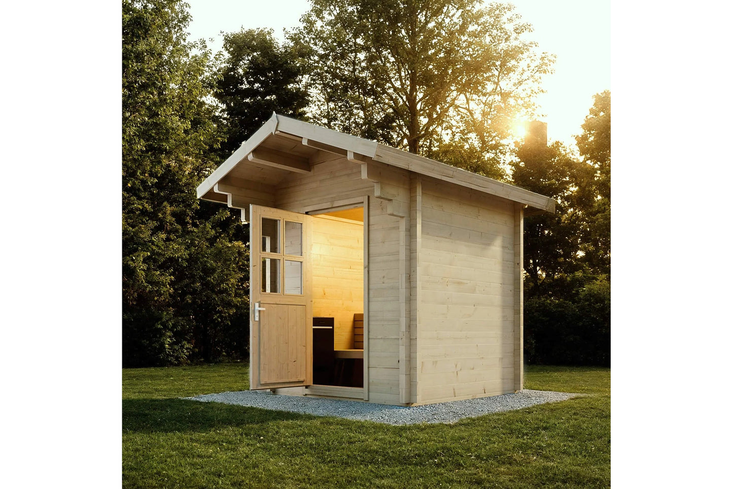 Almost Heaven Saddle Mountain outdoor sauna with light wood construction, open door showing illuminated interior, situated on