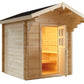Wooden outdoor sauna with pitched roof, black trim, glass door with interior benches illuminated by warm lighting, on white b