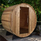 Wooden barrel sauna with natural light wood finish, dark wood door with metal handle, mounted on black metal support frame in