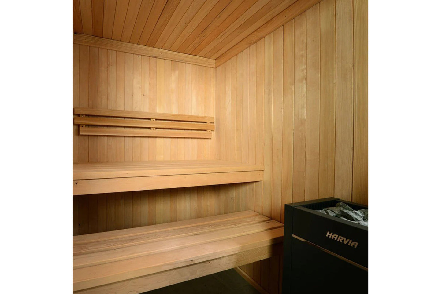 Interior view of wooden sauna with light wood walls, ceiling, tiered benches, and black Harvia heater unit in corner