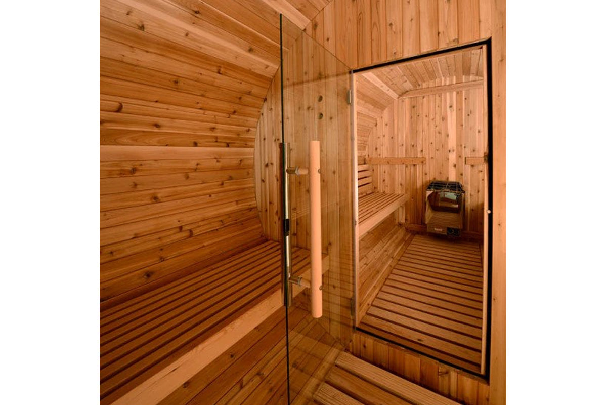 Almost Heaven Shenandoah 4-person barrel sauna interior with wooden benches, glass door with black frame, and wood-burning st