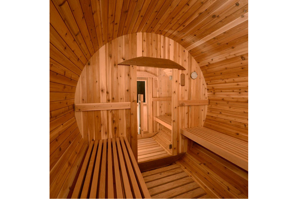Almost Heaven Shenandoah barrel sauna interior showing natural wood construction with curved ceiling, wooden benches on both 