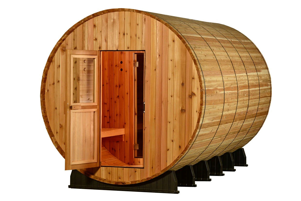 Barrel-shaped wooden sauna with cedar construction, open door showing red-stained interior, small window, and black metal sup