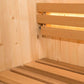 Interior view of wood sauna with tiered wooden benches and backrest, lit by integrated heating elements
